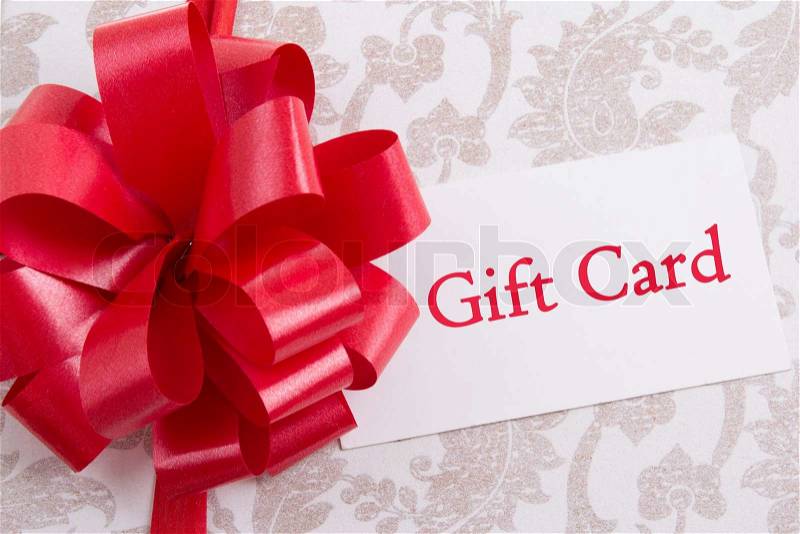 Gift box with big red bow and gift card, stock photo