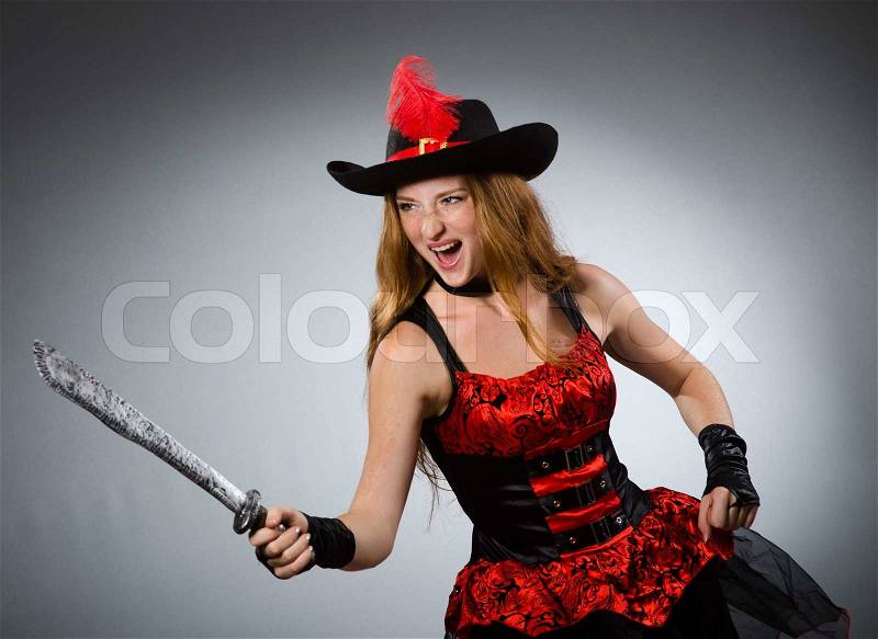 Woman pirate with sharp weapon, stock photo