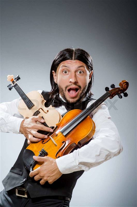 Funny fiddle violin player in musical concept, stock photo