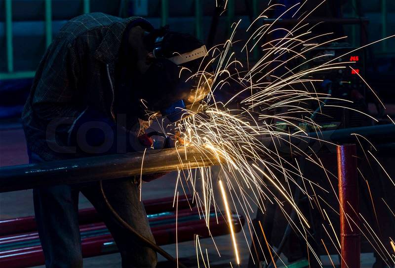 Welding steel structure in factory, stock photo