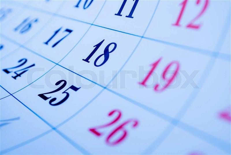 Blank calendar with squares viewed obliquely with focus to the dates of the 18th and 25th, stock photo