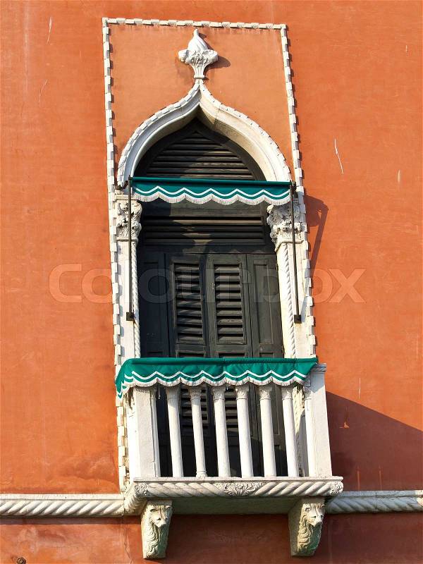Ancient balcony on the orange villa in Venice, stock photo
