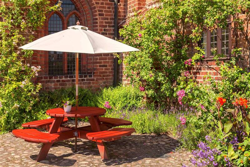 Image of tranquil back garden seating area, stock photo