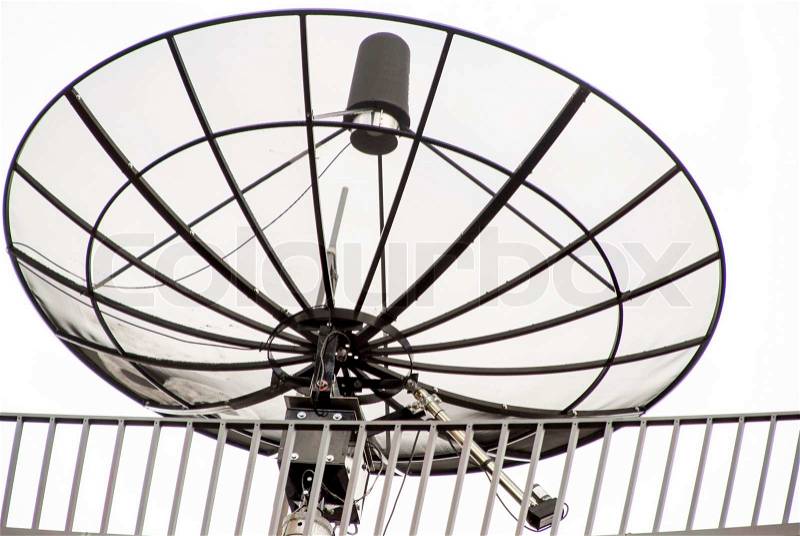 Satellite antenna on the roof of a house, stock photo
