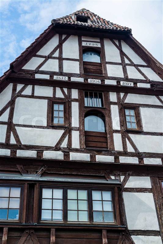 Beautiful half timbered house built in 1403 (the 8 on the upper year date is only half painted and therefore means 4) in Besigheim, South Germany, stock photo