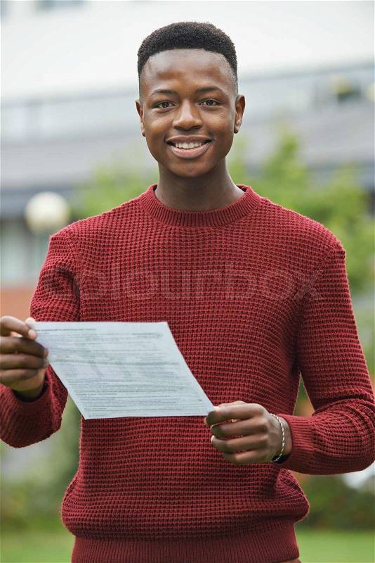 Teenage Boy Pleased With Good Exam Results, stock photo