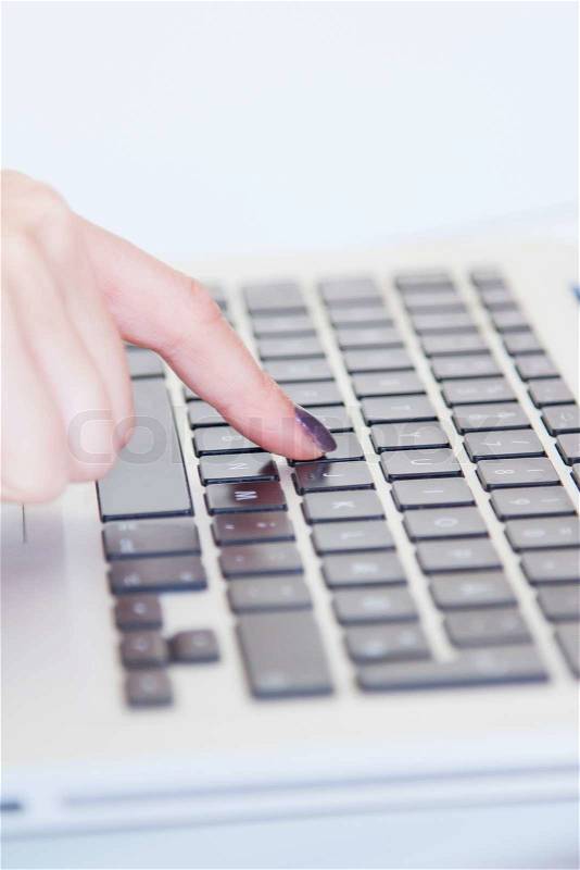 Young female hands on computer keyboard close-up, stock photo