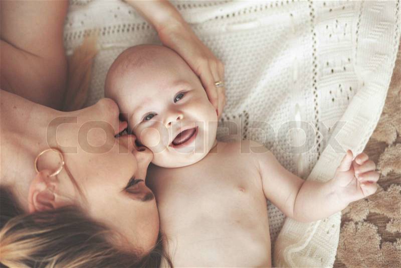 Portrait of a mother with her 3 monthes old baby, top view point, stock photo