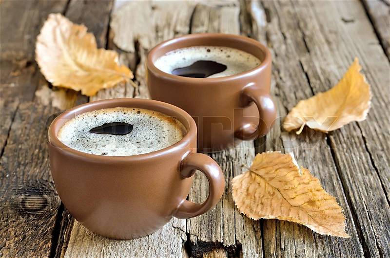 Coffee cup in an autumn morning, stock photo