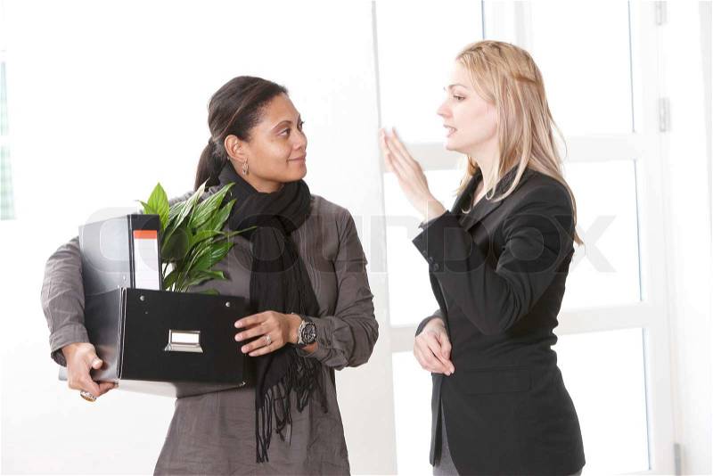 Two female work colleagues - one was got fired, stock photo
