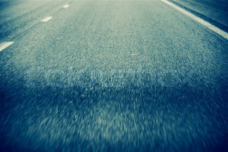 On the Road Background. Road in Motion. Pavement Closeup During Driving, stock photo