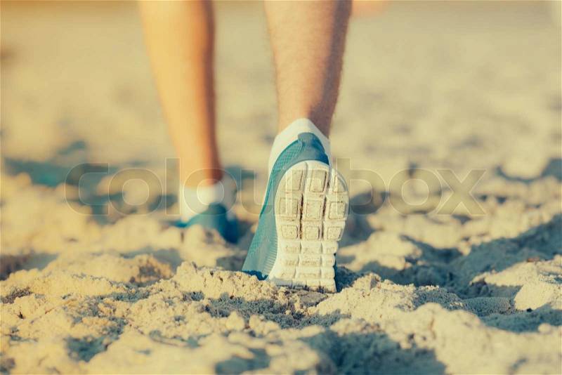 Athlete running in the sand feet, stock photo
