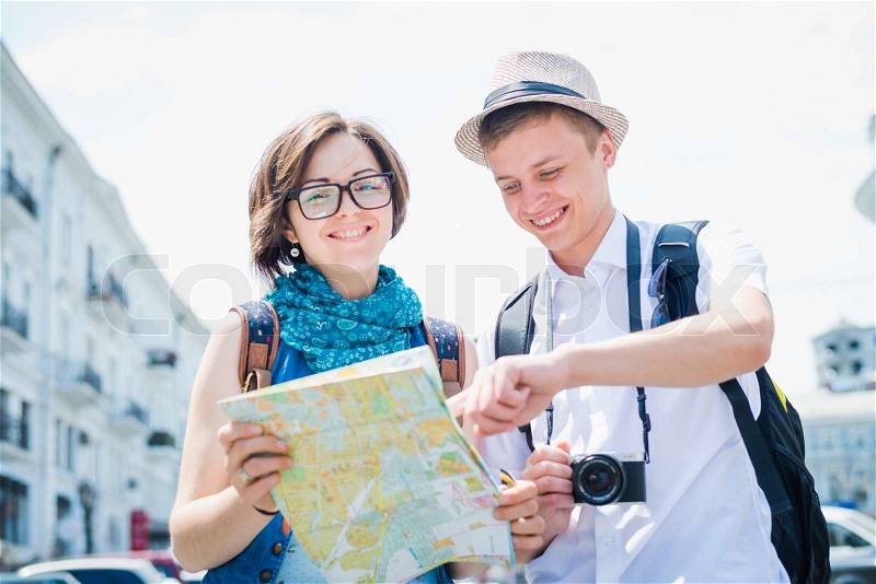 Tourists with map, stock photo
