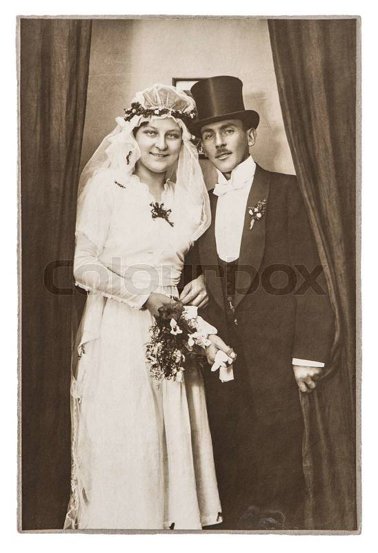 BERLIN, GERMANY - CIRCA 1930: antique wedding photo. portrait of just married couple. nostalgic picture with original scratches and film grain, stock photo