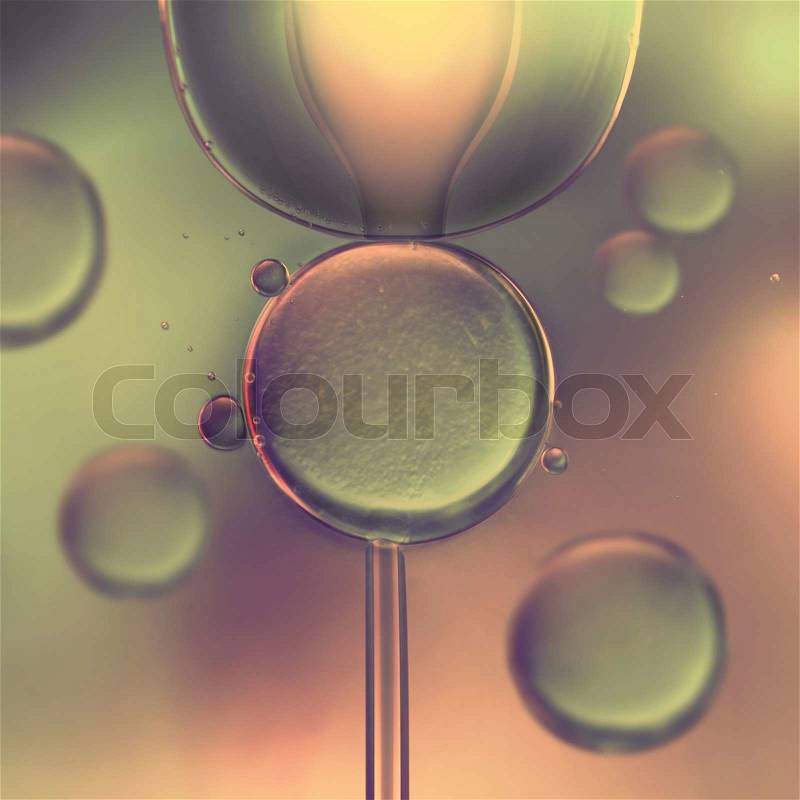 Image concept of in vitro fertilization assisted by microscope, stock photo