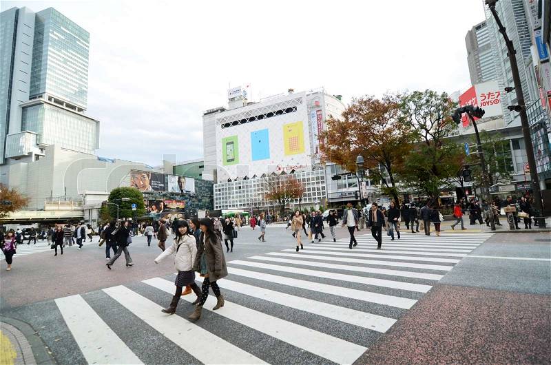 Tokyo, Japan - November 28, 2013: Crowds of people crossing the center of Shibuya in November 28 2013, the most important commercial center in Tokyo, Japan , stock photo