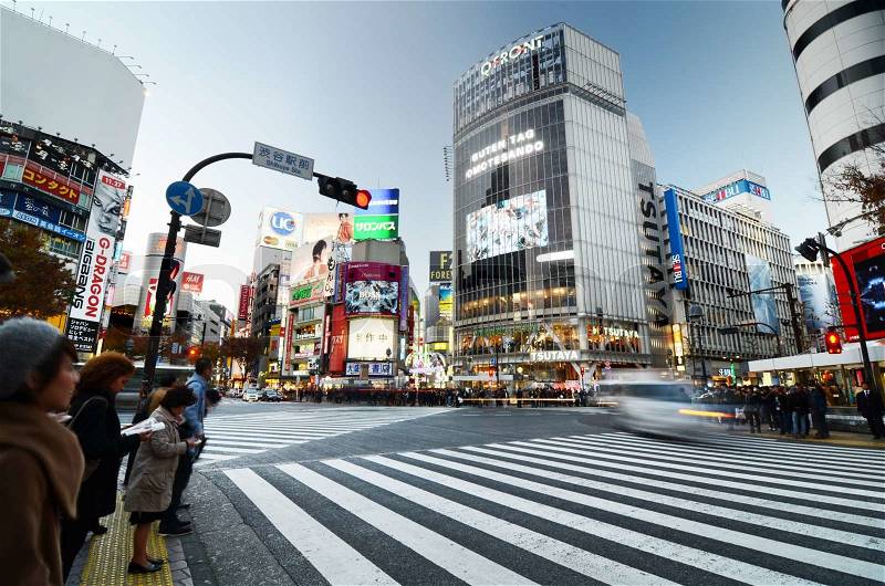 Tokyo, Japan - November 28, 2013: Crowds of people crossing the center of Shibuya district on November 28 2013, Shibuya is the most important commercial center in Tokyo, Japan , stock photo
