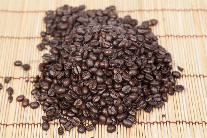 Pile coffee beans on top table wooden.black beans coffee, stock photo