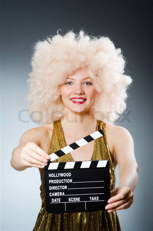 Blond woman with movie board , stock photo