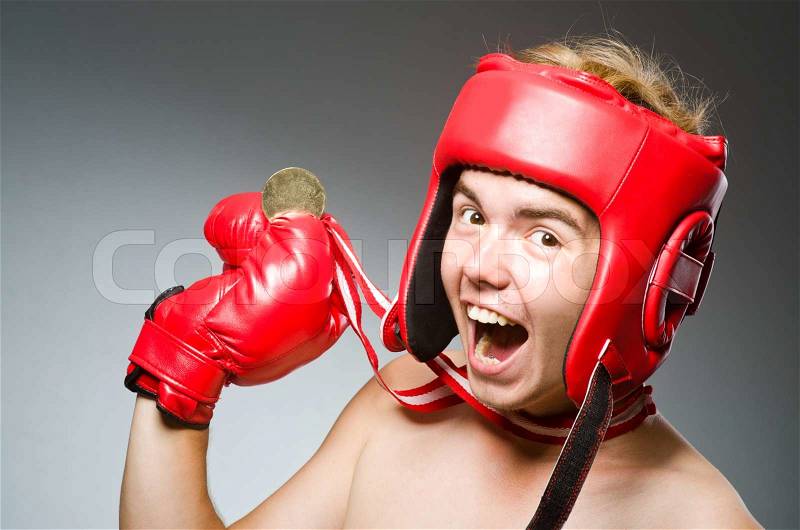 Funny boxer with winning gold medal, stock photo