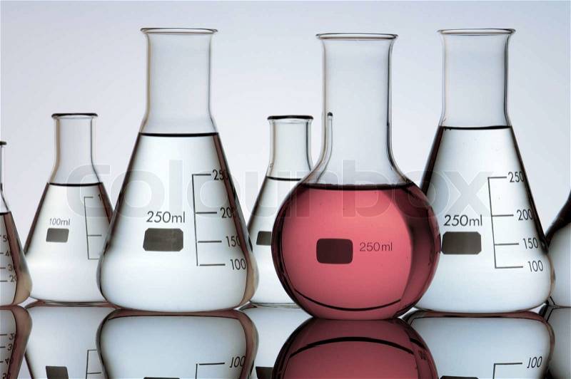 Group of laboratory flasks containing liquid color, stock photo