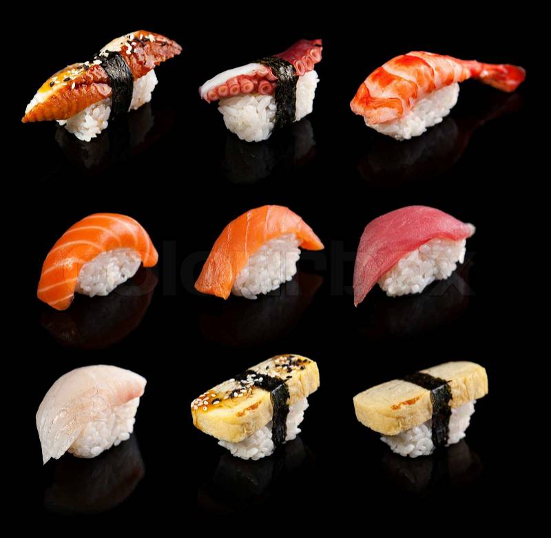 Nigiri sushi set on a black background, stock photo