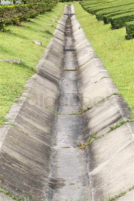Concrete drainage channel in park, stock photo