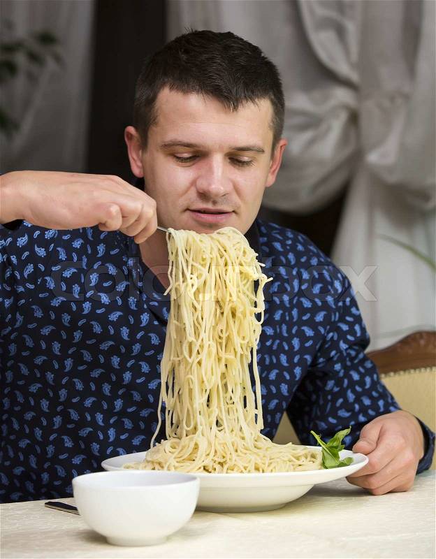 11400097-man-eating-a-large-portion-of-pasta-in-a-restaurant.jpg