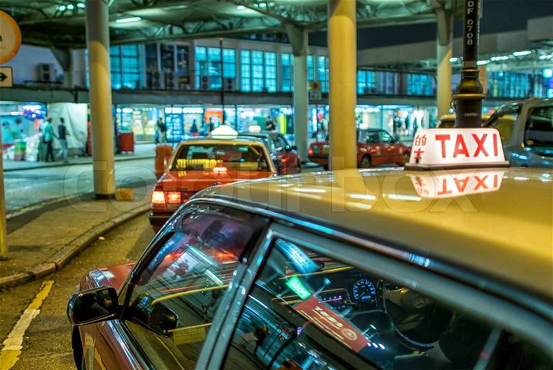 HONG KONG - APRIL 12: Taxis on the street on April 12, 2014 in Hong Kong. Over 90% daily travelers use public transport. Its the highest rank in the world, stock photo