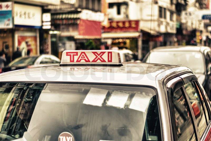 HONG KONG - APRIL 12: Taxis on the street on April 12, 2014 in Hong Kong. Over 90% daily travelers use public transport. Its the highest rank in the world, stock photo