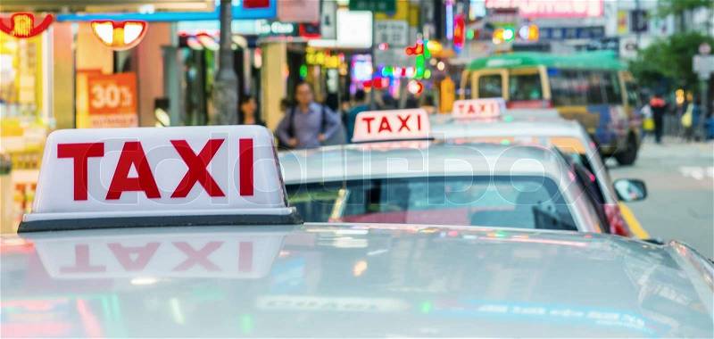 HONG KONG - MAY 11: Taxis on city streets on May 11, 2014 in Hong Kong. Over 90% daily travelers use public transport. Its the highest rank in the world, stock photo