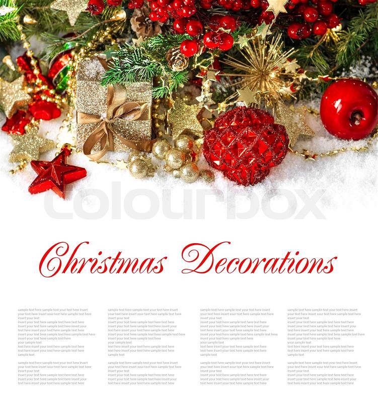 Christmas composition with red baubles, golden decorations, gifts, pine and berries branches. festive arrangement wit sample text, stock photo