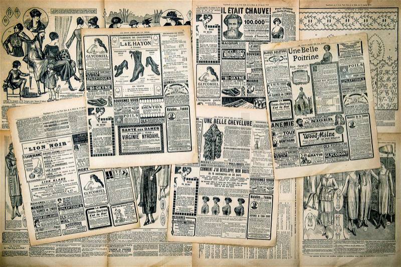 Newspaper pages with antique advertising. Woman\'s fashion magazine Le Petit Echo de la Mode from 1919. Retro style toned picture, stock photo