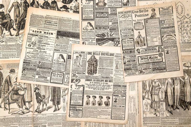 Newspaper pages with antique advertising. Woman\'s fashion magazine Le Petit Echo de la Mode from 1919, stock photo