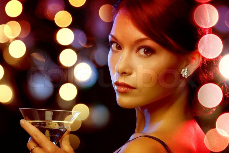 Luxury, vip, nightlife, party concept - beautiful woman in evening dress with cocktail, stock photo