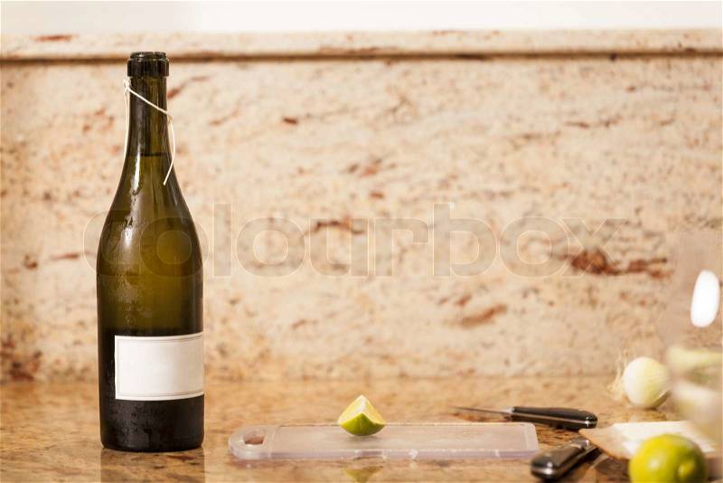 White Wine Bottle with Two Garnished Glasses of Wine, stock photo