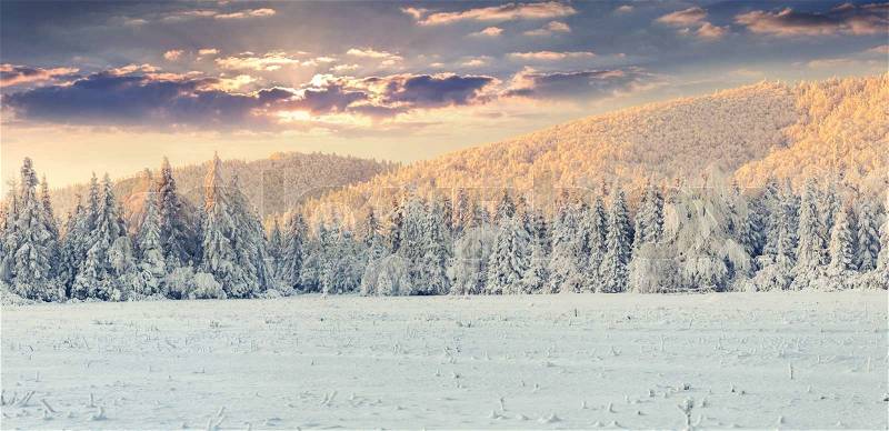 Panorama of the winter sunrise in the mountains. Retro style, stock photo