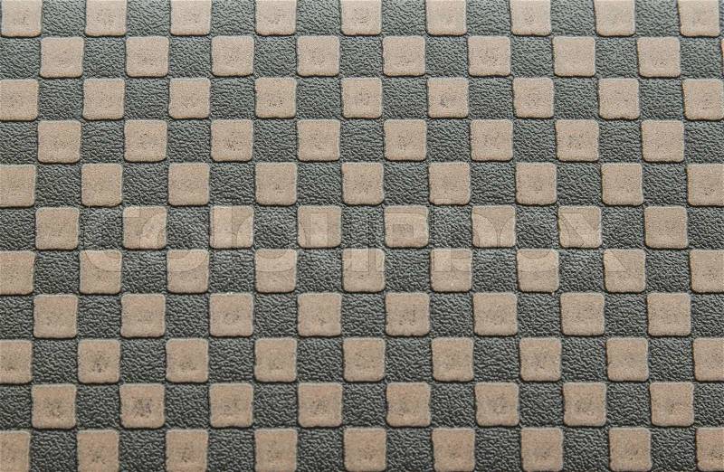 Old brown leather background by checkerboard pattern, stock photo
