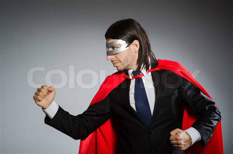 Superman concept with man in red cover, stock photo
