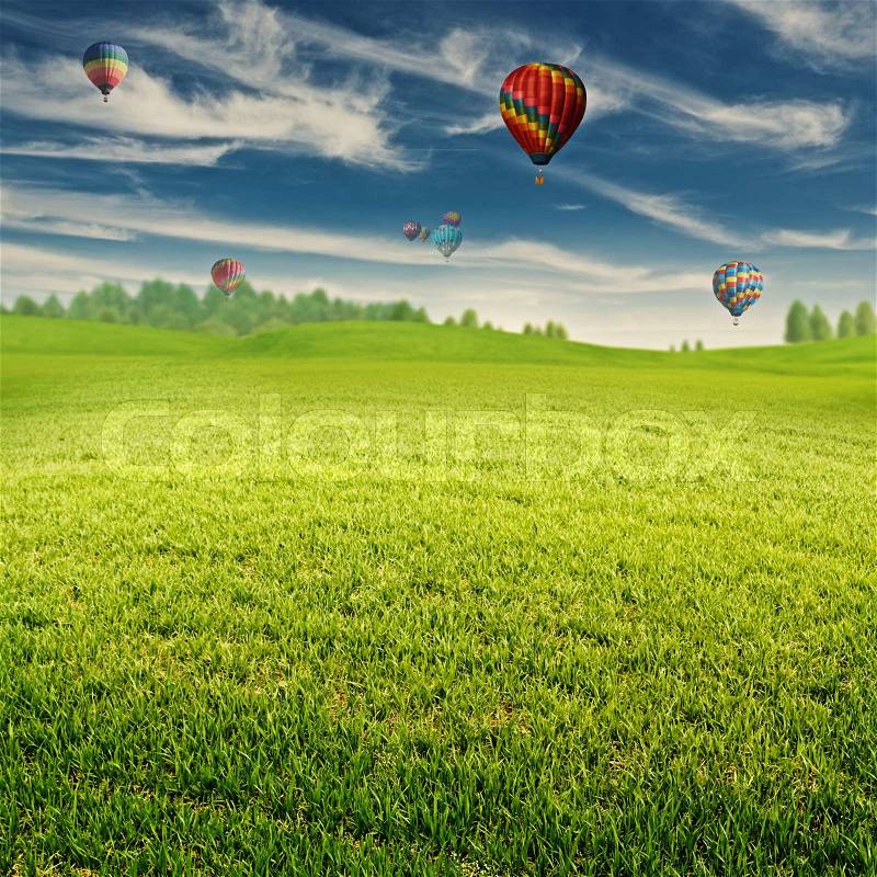 Summer field with lot of air balloons over horizon, abstract landscape, stock photo