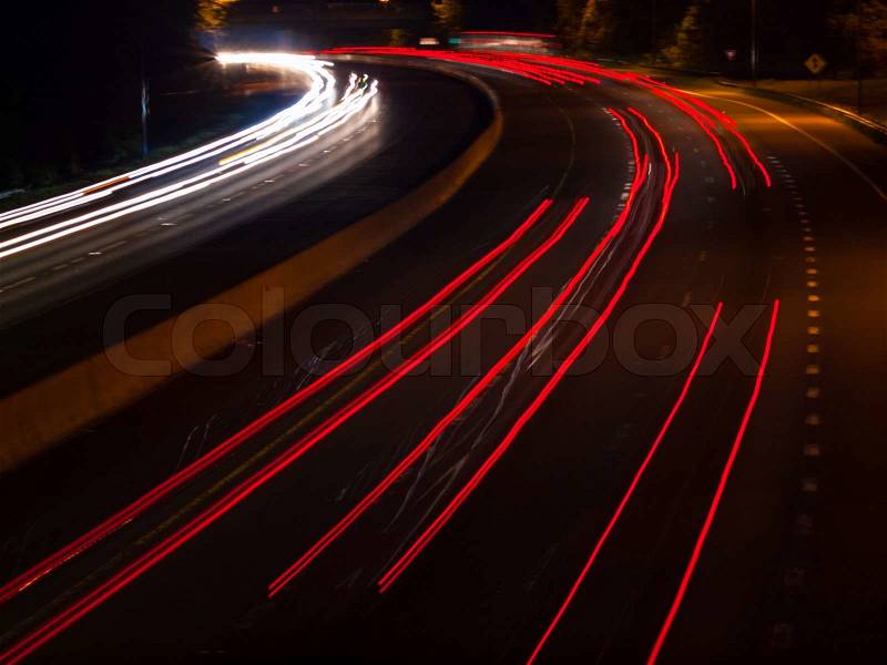 Headlight and Taillight Trails on a Busy Highway at Night, stock photo