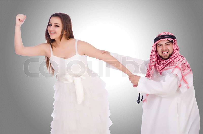 Arab man with his wife on white, stock photo