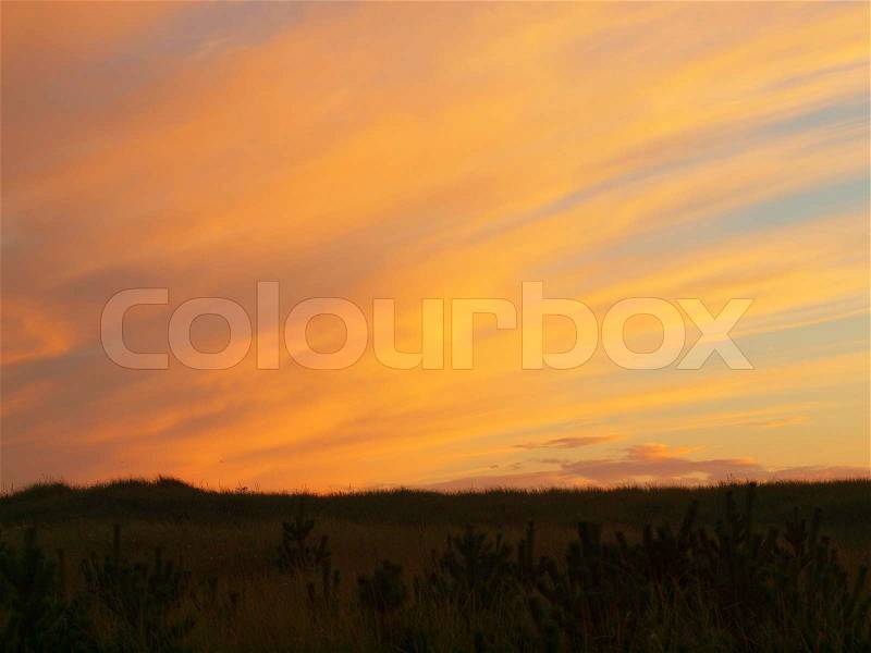 Golden and Pink Cloudy Sunset at the Beach, stock photo