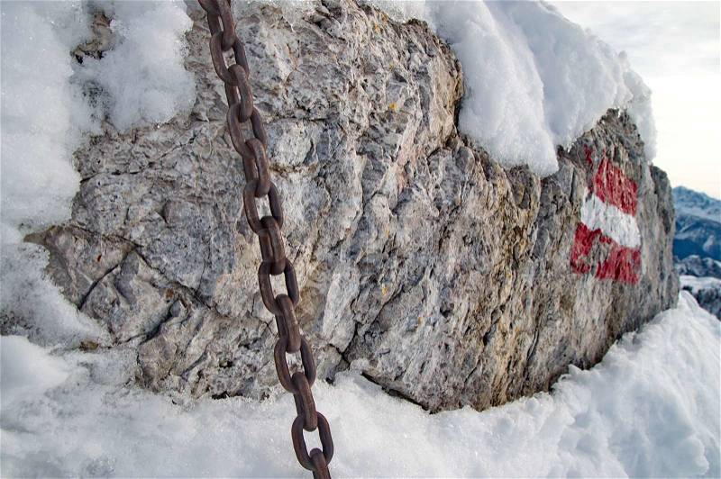 Strong chain on rock, stock photo