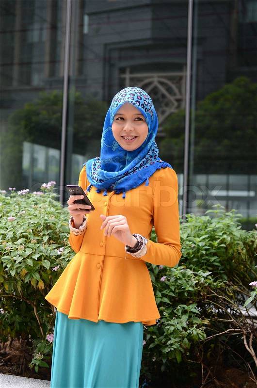 Young asian muslim woman in head scarf smile , stock photo