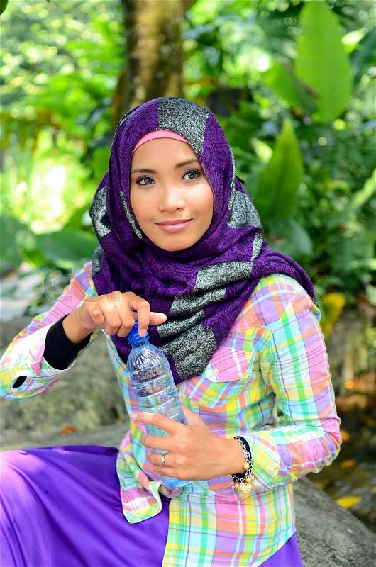 Young asian muslim woman in head scarf smile , stock photo