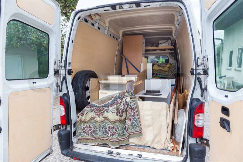 Interior of A Moving Van On Street With Household Furnishings, stock photo