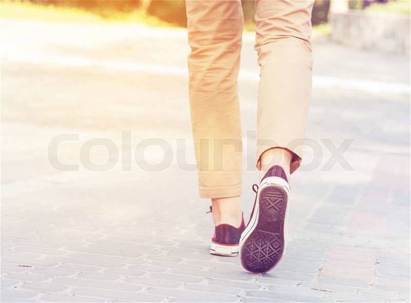 Woman sunny walk legs gumshoes, stock photo