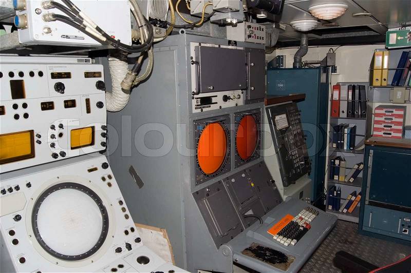 Control room in small cold war warship, stock photo