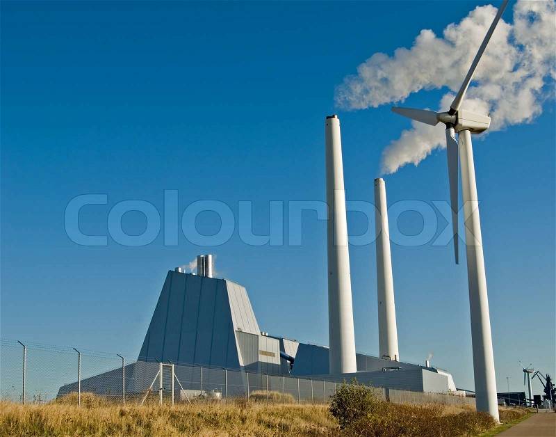Wind mills in front of coal firedpowerplant, stock photo